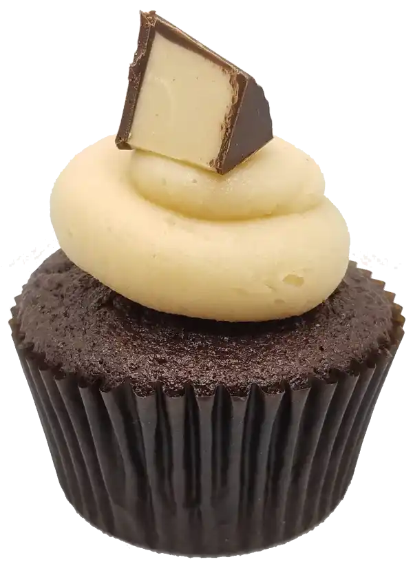 A chocolate cupcake with rich peanut butter frosting and a handmade PB cup wedge.