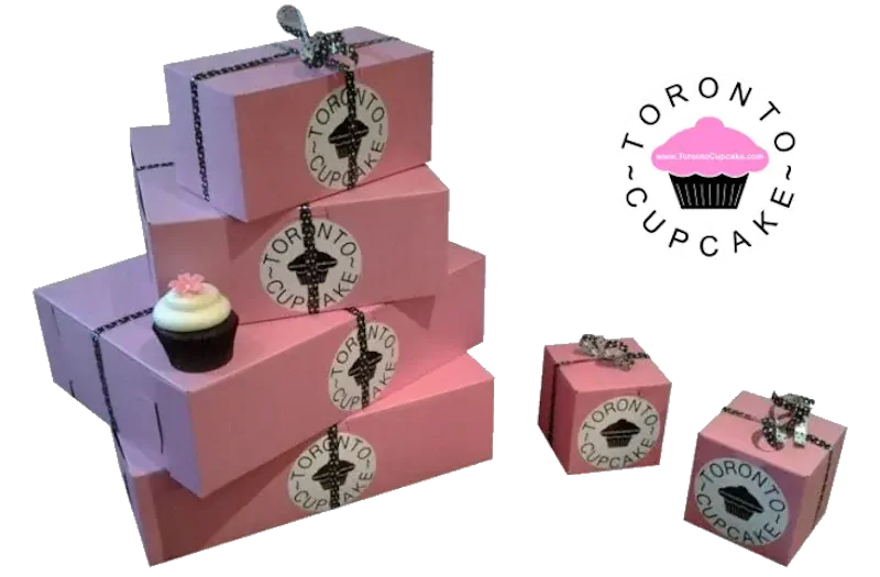 Boxes of cupcakes stacked upon eachother