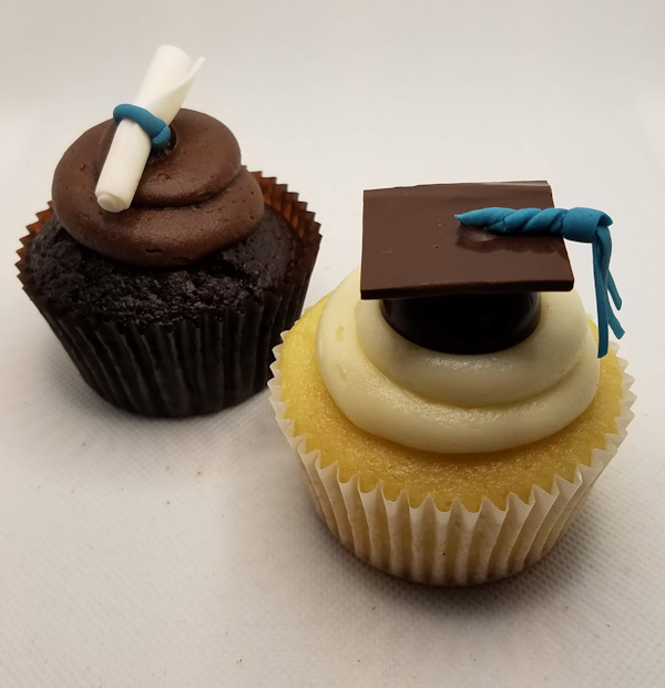 Pair of graduation themed cupcakes