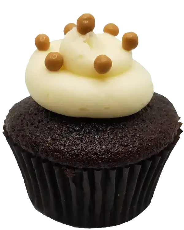 Chocolate cupcake filled with creamy Dulce de leche filling, covered with vanilla icing and topped with caramel crisp pearls.